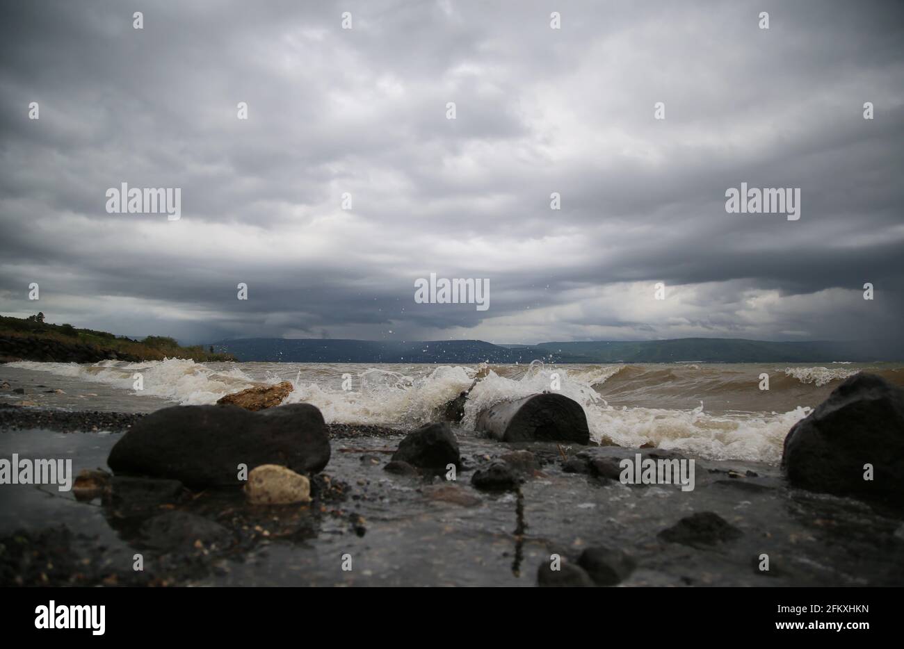 The waves of the Sea of Galilee crash on the beach of, Israel Stock