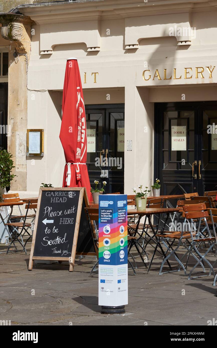 Tables and chairs set up outside cafes, restaurants and bars in the ...