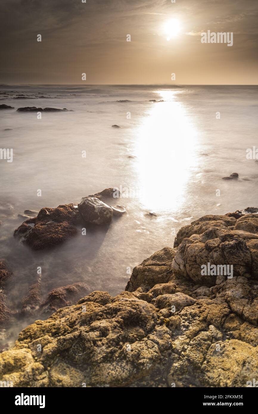 Calm ocean surface rocky beach hi-res stock photography and images - Alamy