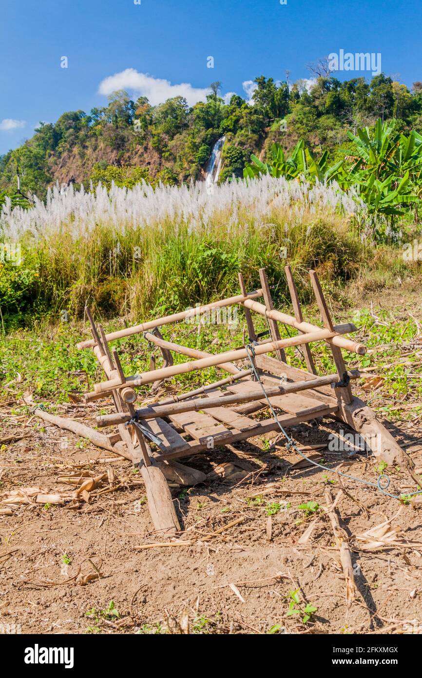 Broken wooden cart in fields near Hsipaw, Myanmar Stock Photo