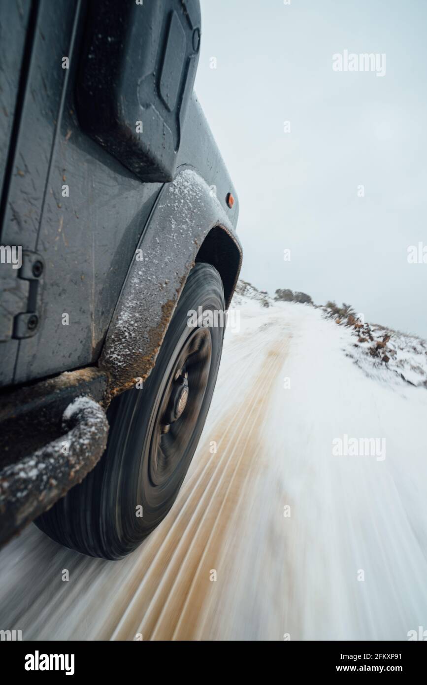 4x4 driving across snowy and icy road Stock Photo Alamy
