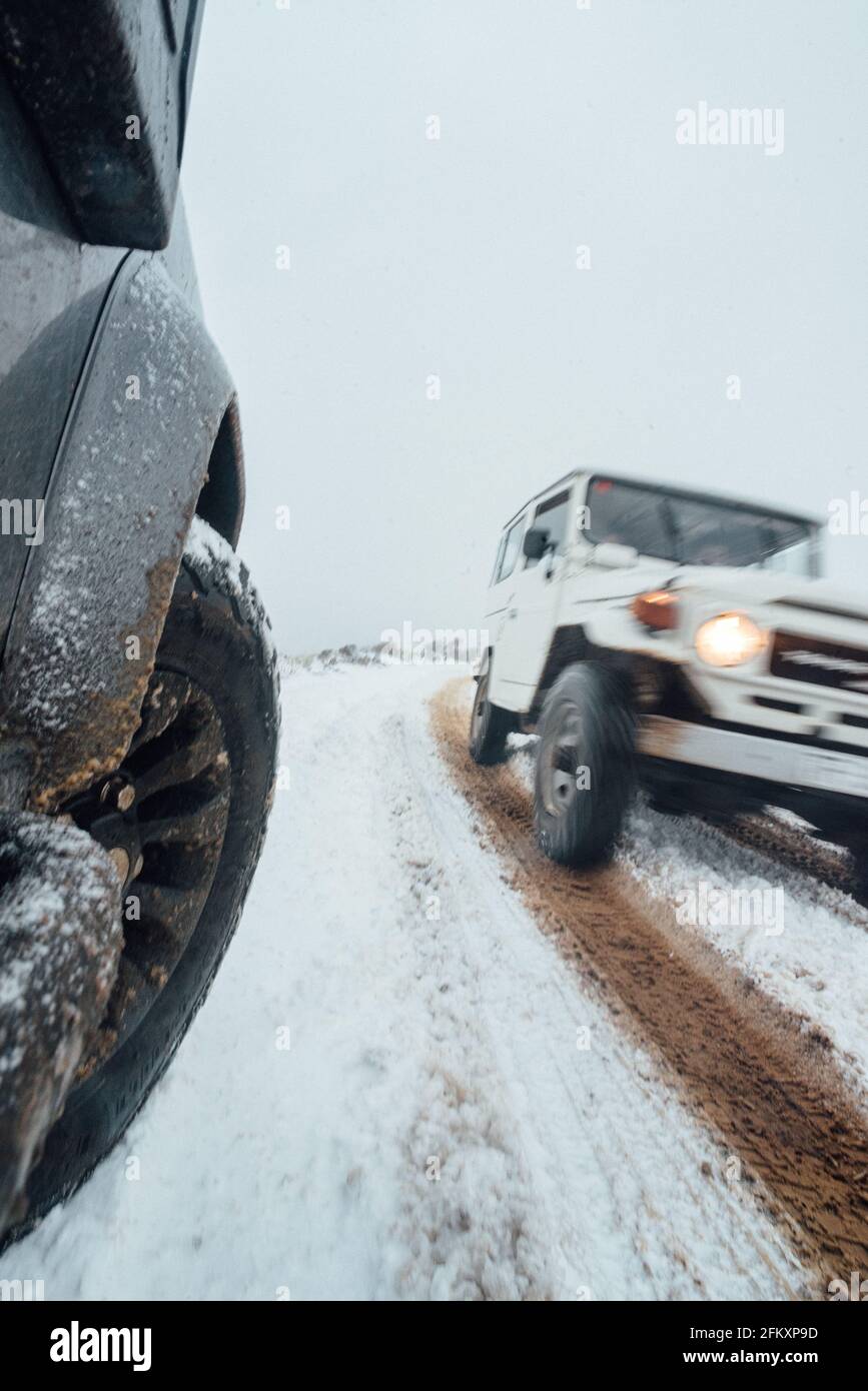 4x4 cars driving across snowy and icy road in Tenerife Stock Photo Alamy