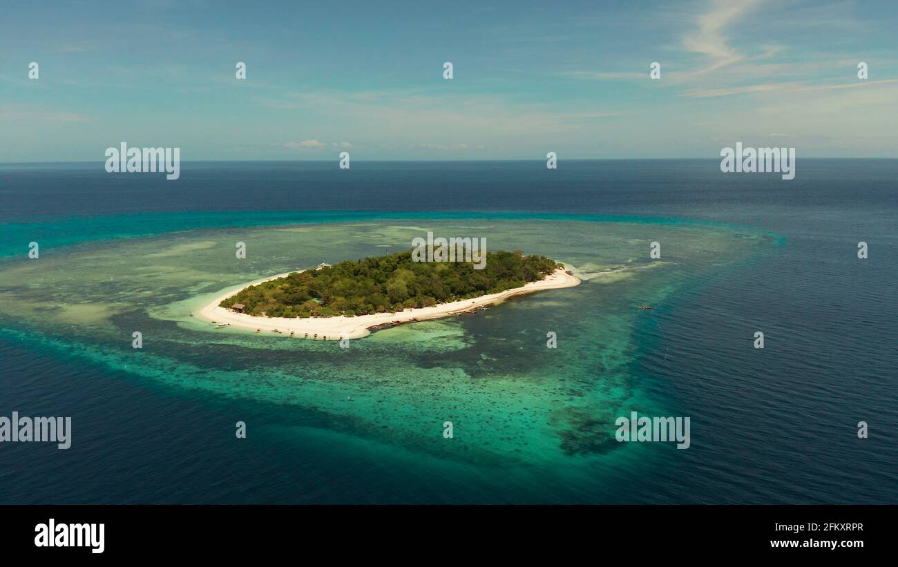 Tropical island with sandy beach with atoll and coral reef, aerial ...