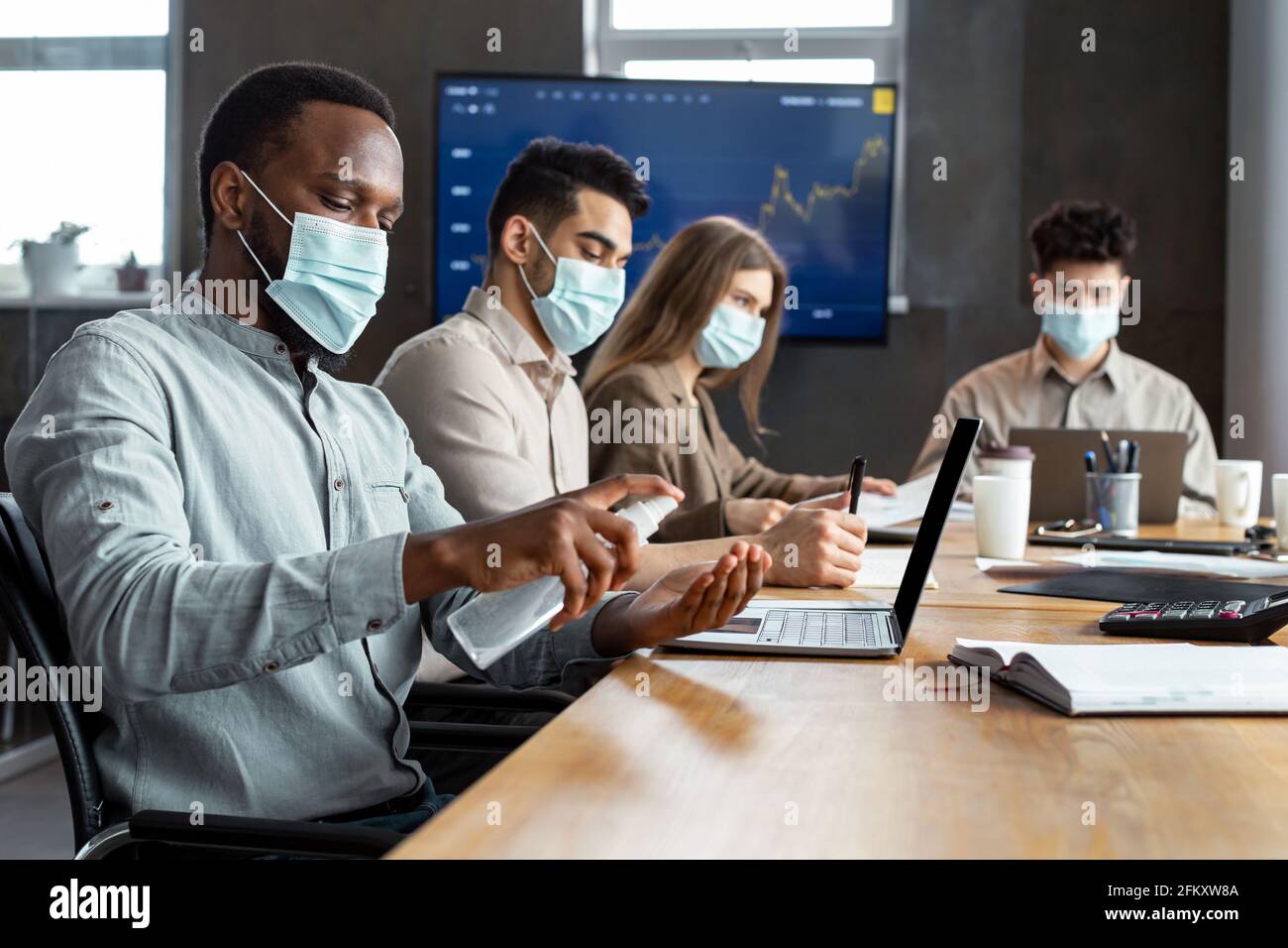 International people wearing medical masks using sanitizer Stock Photo ...