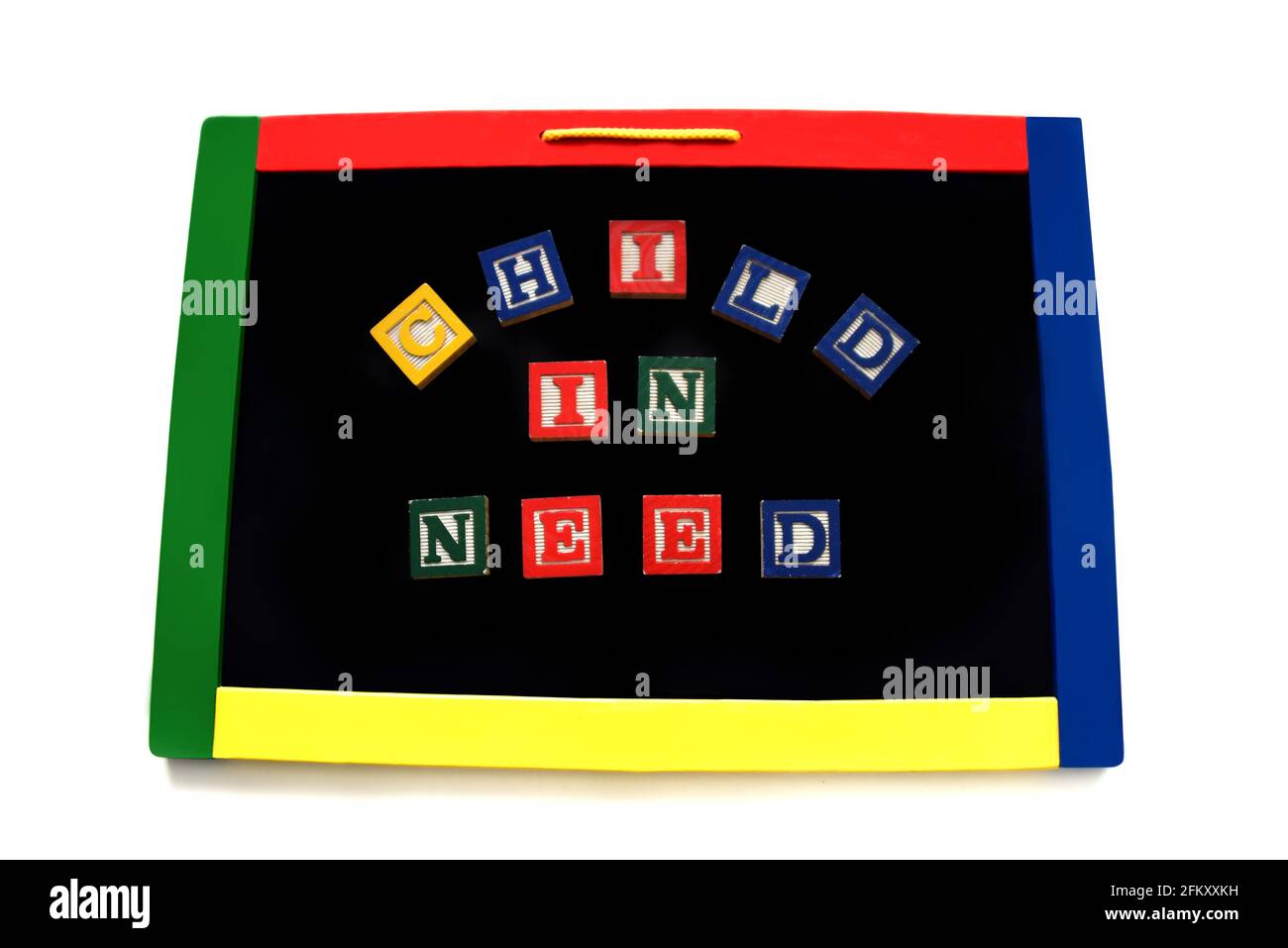 Wooden block letters spell the words child in need on a magnetic board.  Image could represent a hungry child, in need of protection or depression. Stock Photo