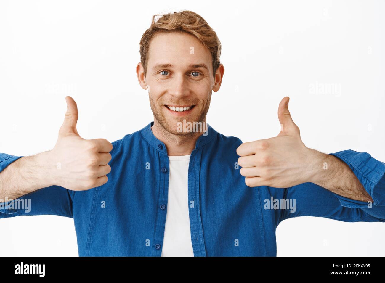 Close up of satisfied happy guy shows thumbs up and smiles, praise  something good, excellent job, compliment your effort, well done, excellent  Stock Photo - Alamy