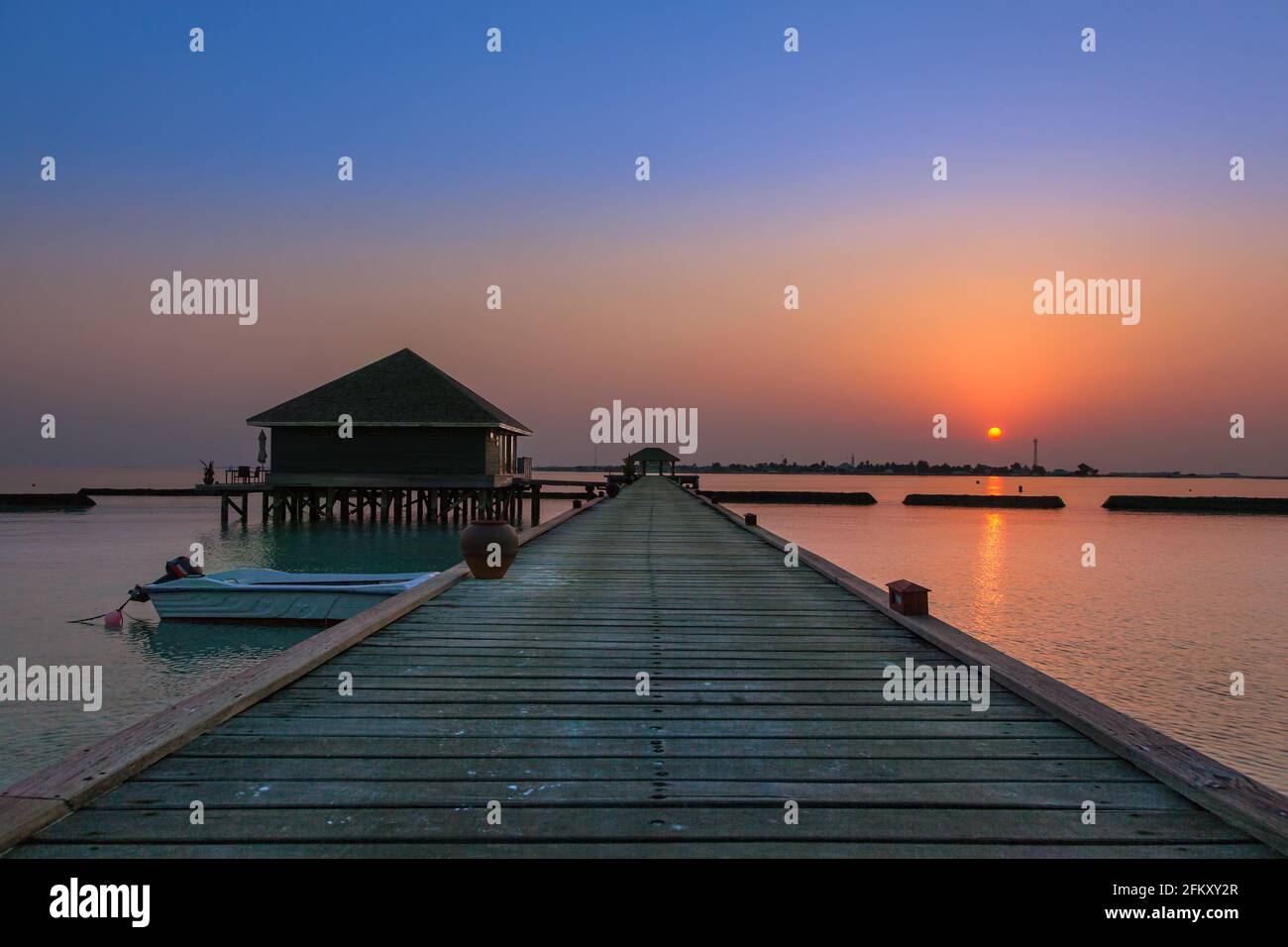 Sunset Jetty Rides View of the sunset along a boat jetty Stock Photo - Alamy