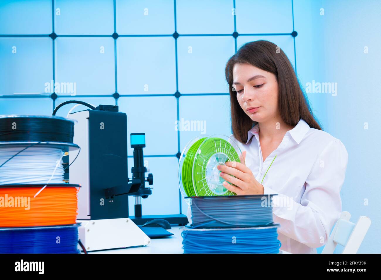 Young woman use 3d printer at office High quality photo Stock Photo - Alamy