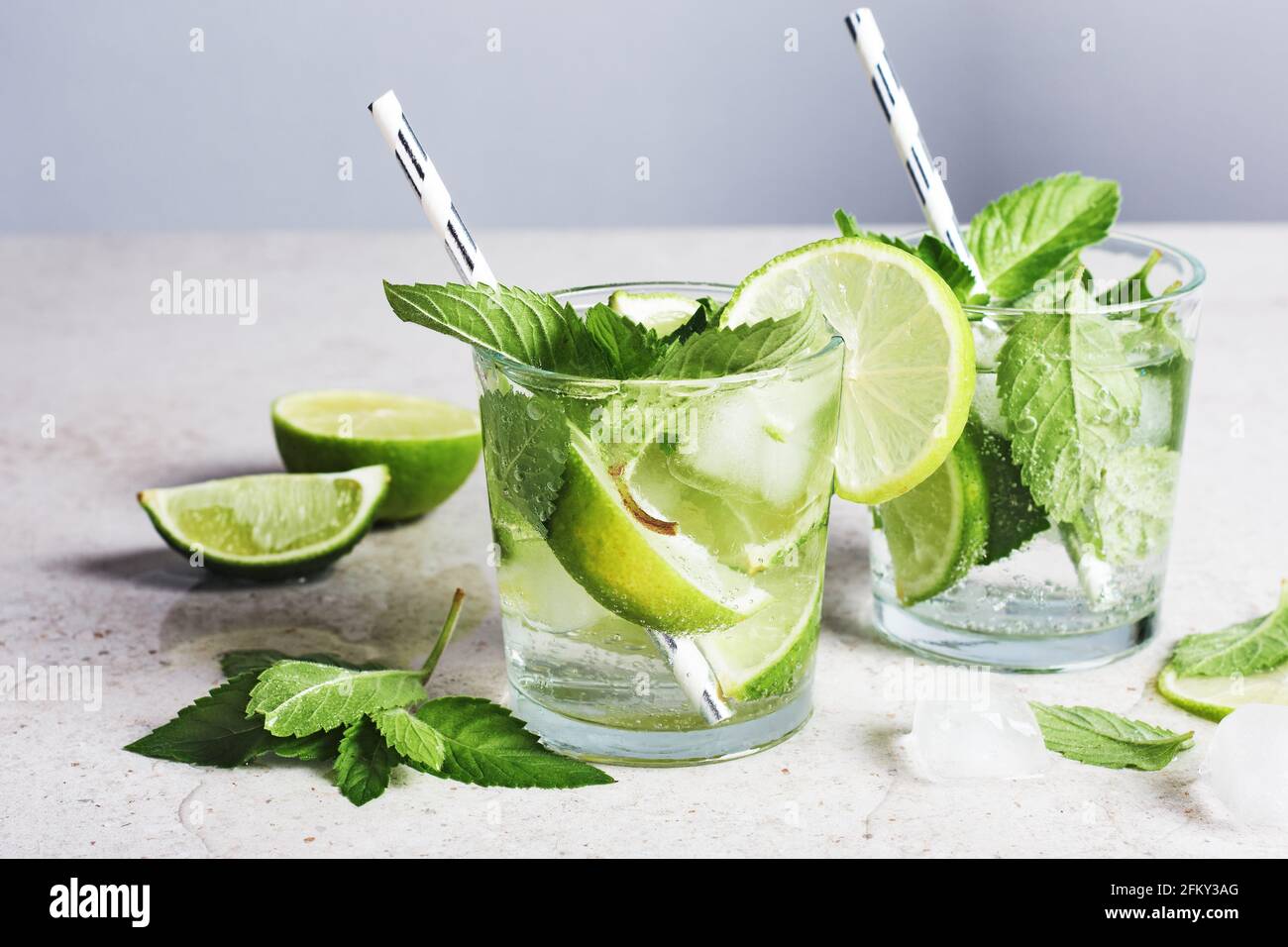 Refreshing drink with lime, mint and ice, mojito cocktail. Stock Photo