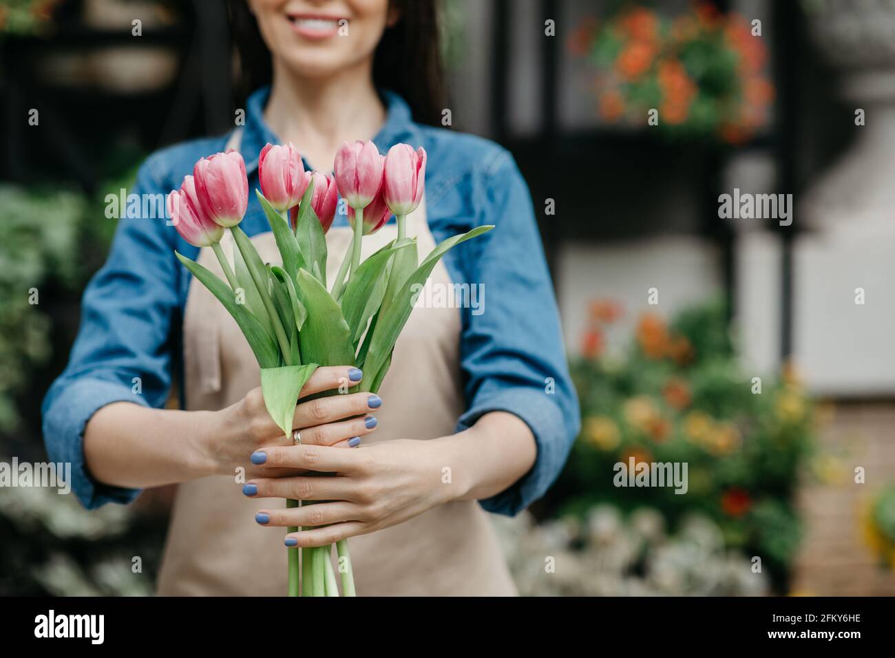 Spring bloom, creating bouquets for holiday and congratulations in plants shop Stock Photo