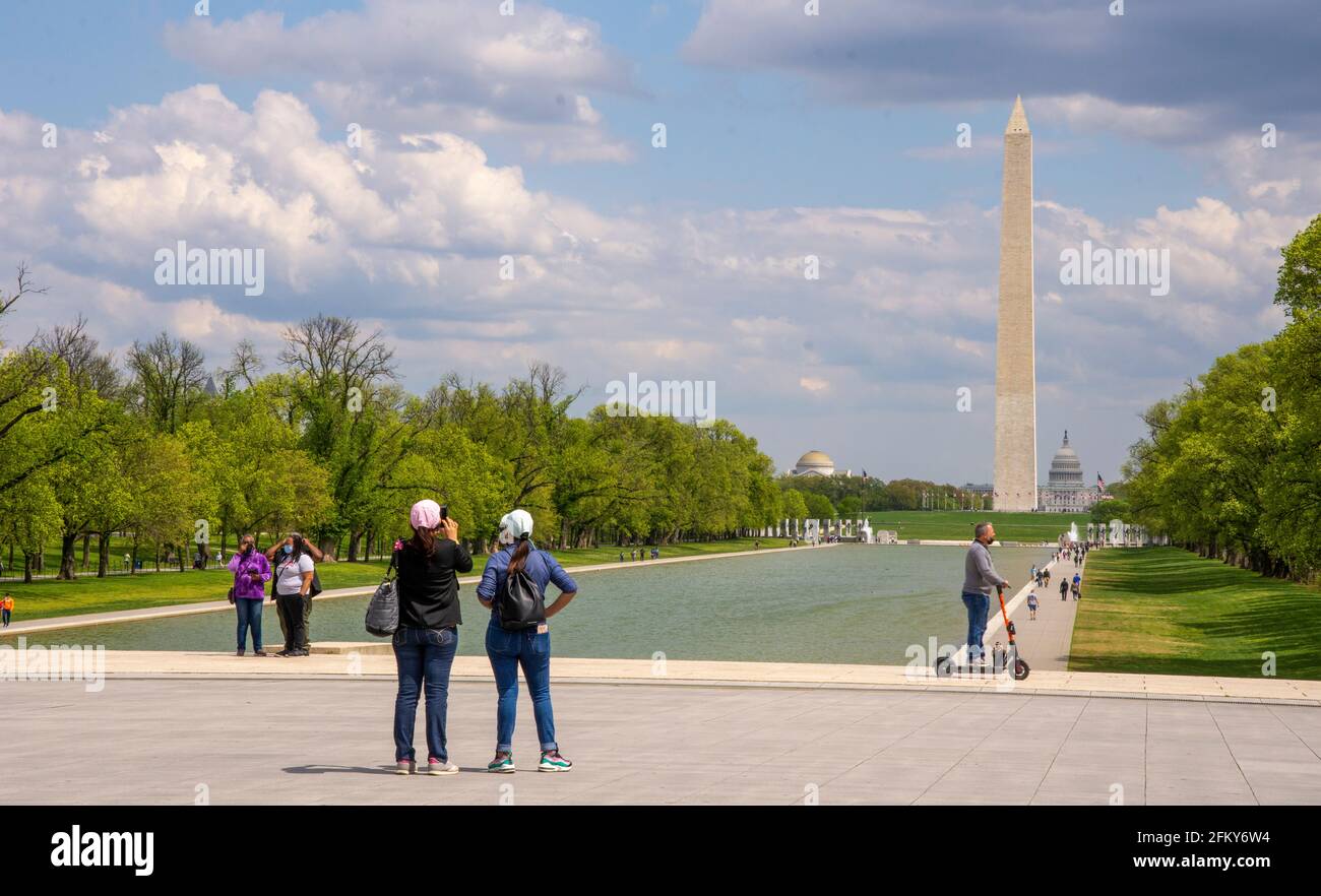 Visitors enjoy the view from the Lincoln Memorial at the National Mall in Washington, DC. Washington Monument and U.S. Capitol are in backgbround. Stock Photo