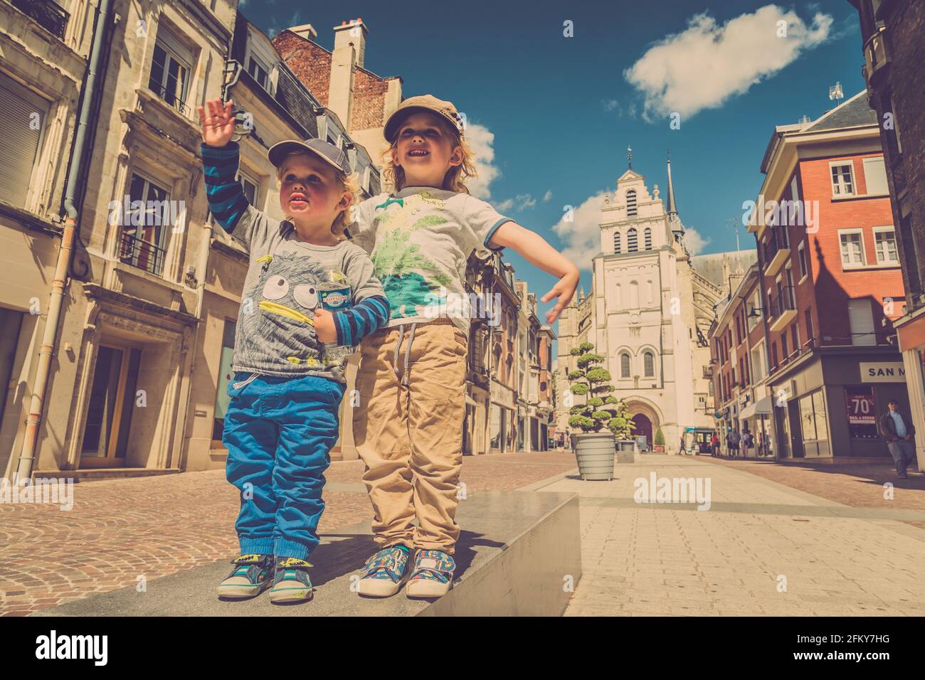 Two young boys dancing in the street Stock Photo