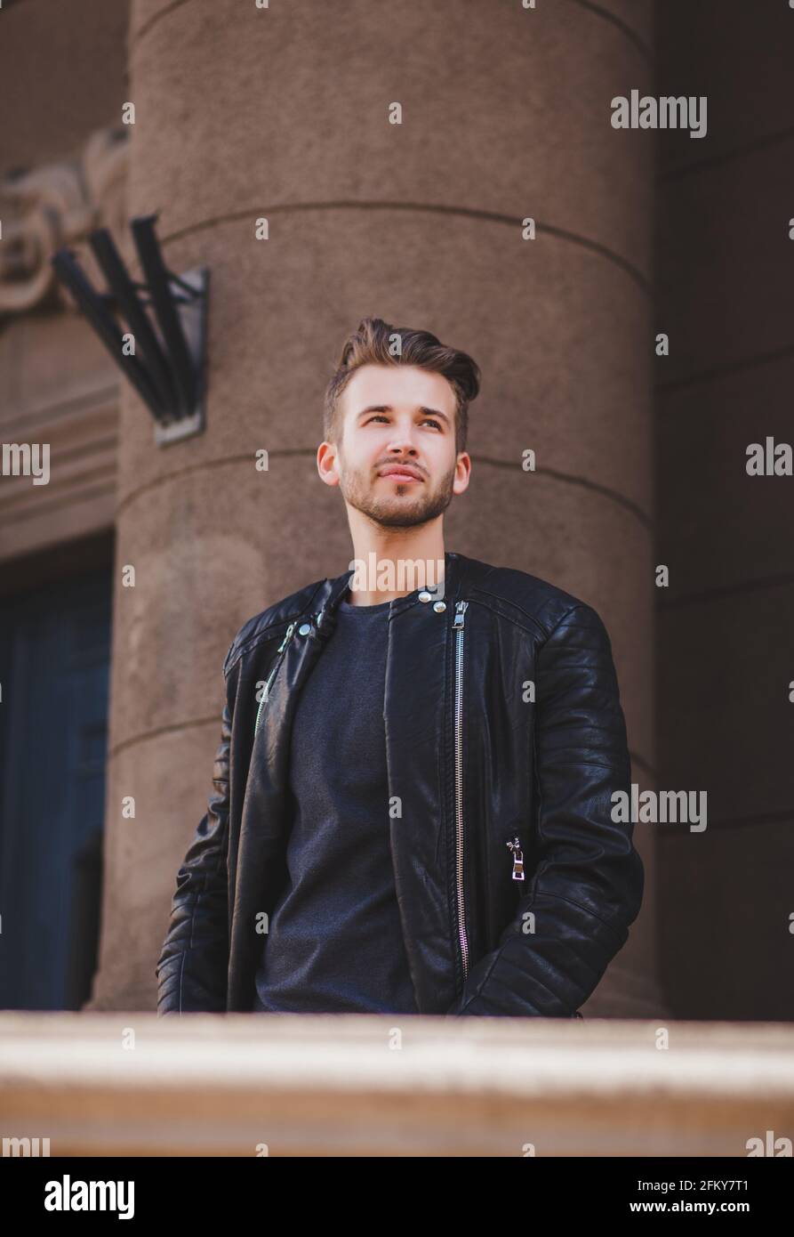 Man in black leather jacket hi-res stock photography and images - Alamy