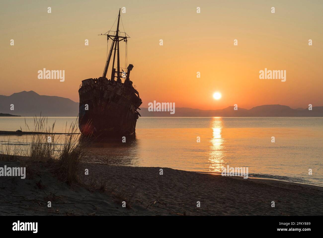 Ship wreck 'Dimitrios' at the Mediterranean coast in Gythion, Peloponnese, Greece at dawn Stock Photo