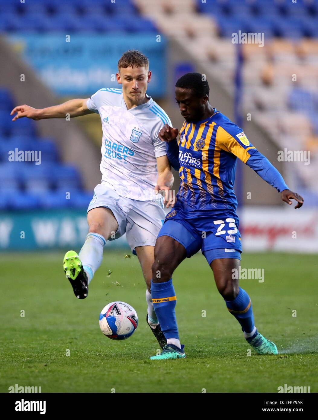 Shrewsbury Town's Daniel Udoh (right) and Ipswich Town's Luke Woolfenden battle for the ball during the Sky Bet League One match at Montgomery Waters Meadow, Shrewsbury. Picture date: Tuesday May 4, 2021. Stock Photo
