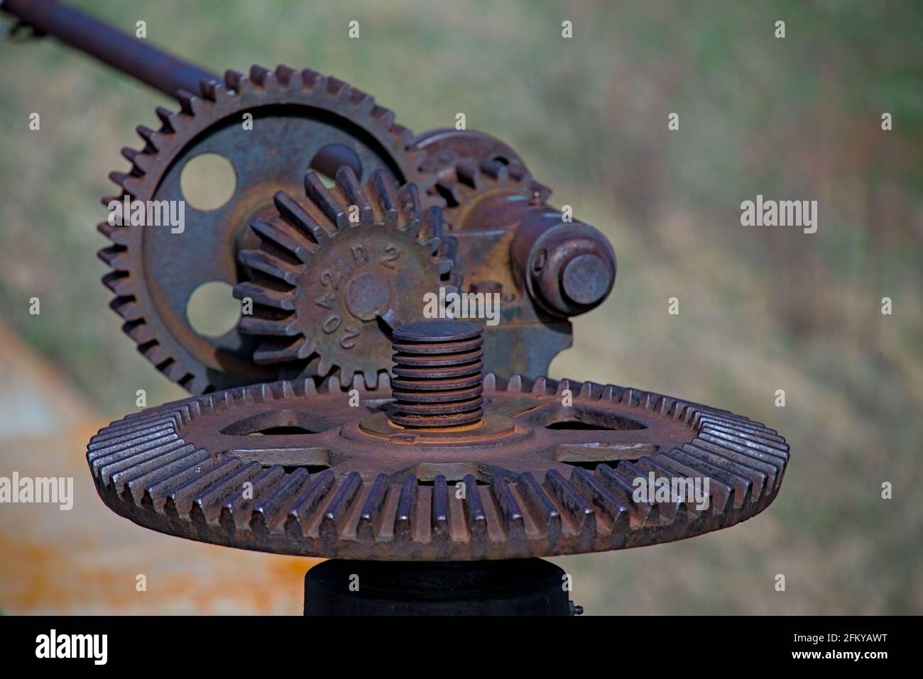 Old gears pulleys for raising lowering flood dam controls rusted closed