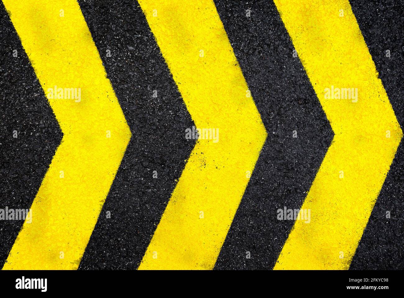 A close up of a yellow and black arrow sign photo – Free Yellow Image on  Unsplash