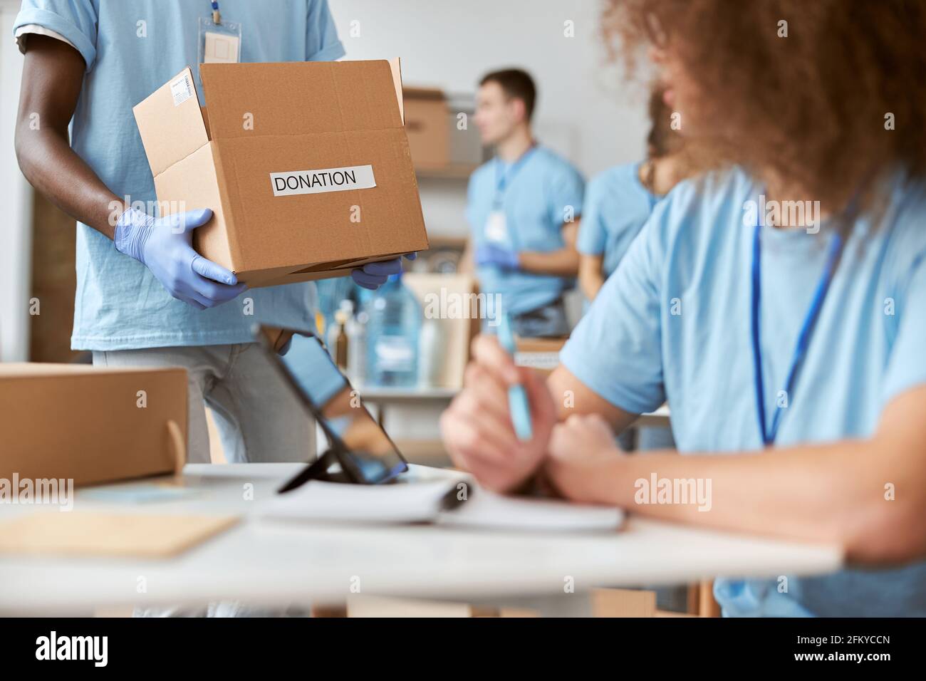 Writing on donation box woman hi-res stock photography and images - Alamy