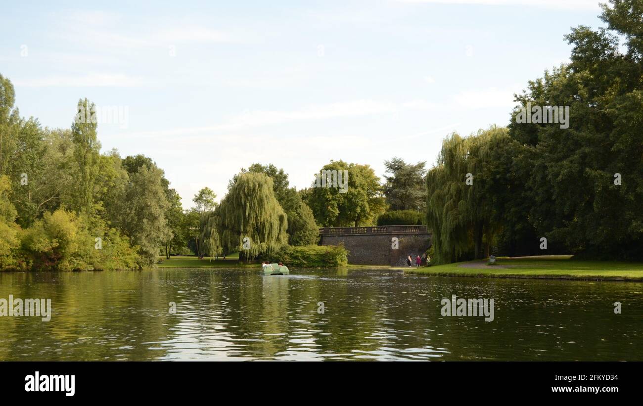 small lake with beautiful botany on which pedal boats go Stock Photo