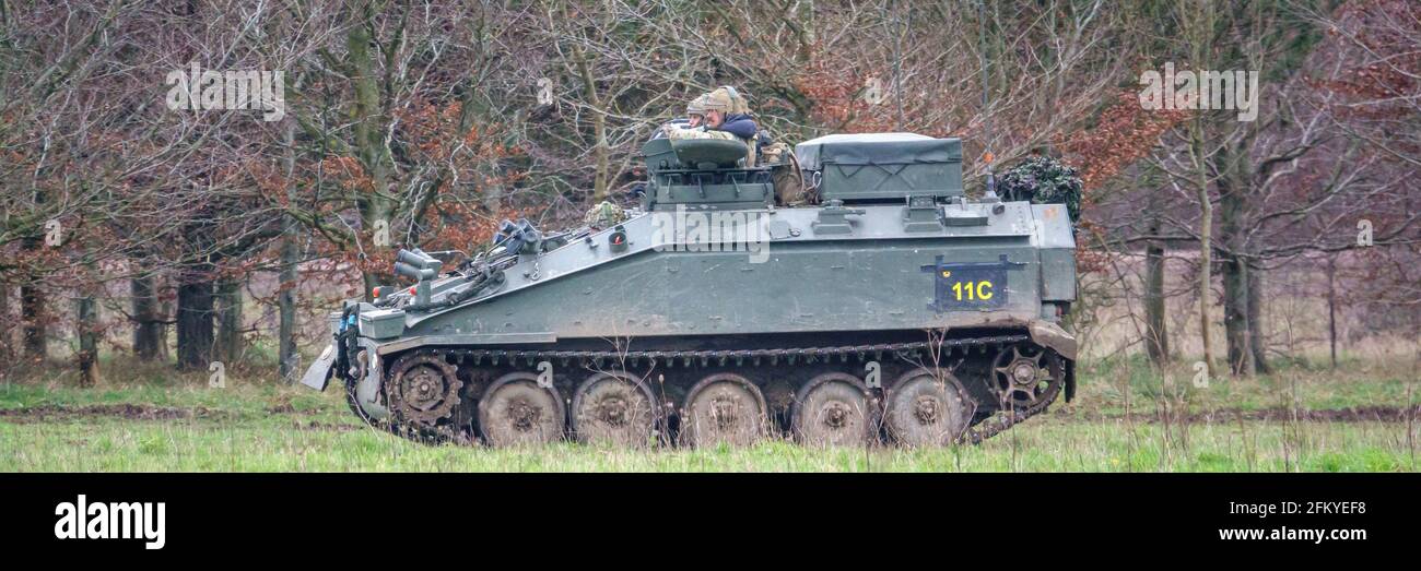british army FV103 Spartan light armored vehicle in action on a