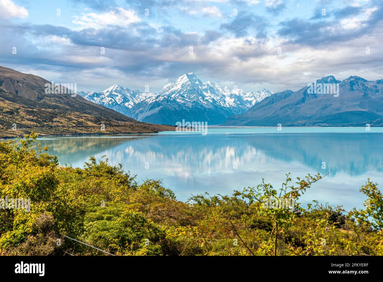 Scenic reflection of Mount Sefton and Mount Cook at lake Pukaki, South Island of New Zealand Stock Photo