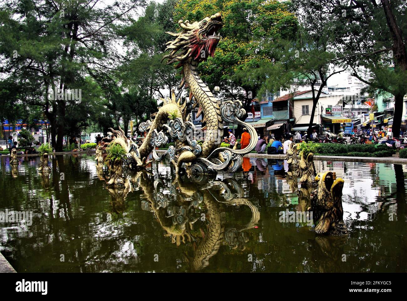 Urban park with pond and dragon fountain sculpture, Chinatown, Ho Chi Minh City, Vietnam, Asia Stock Photo