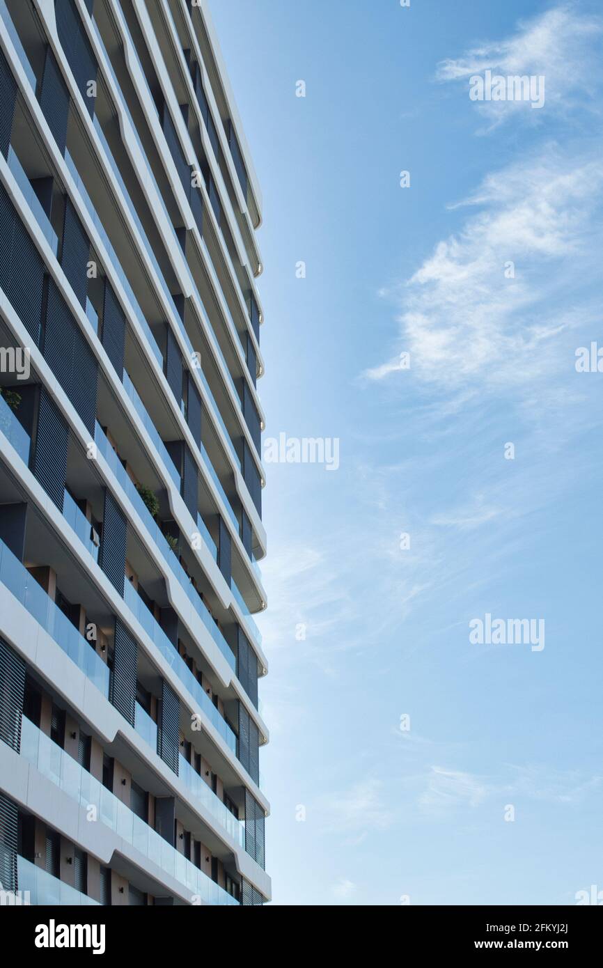 low angle perspective of apartment building with blue sky background ...