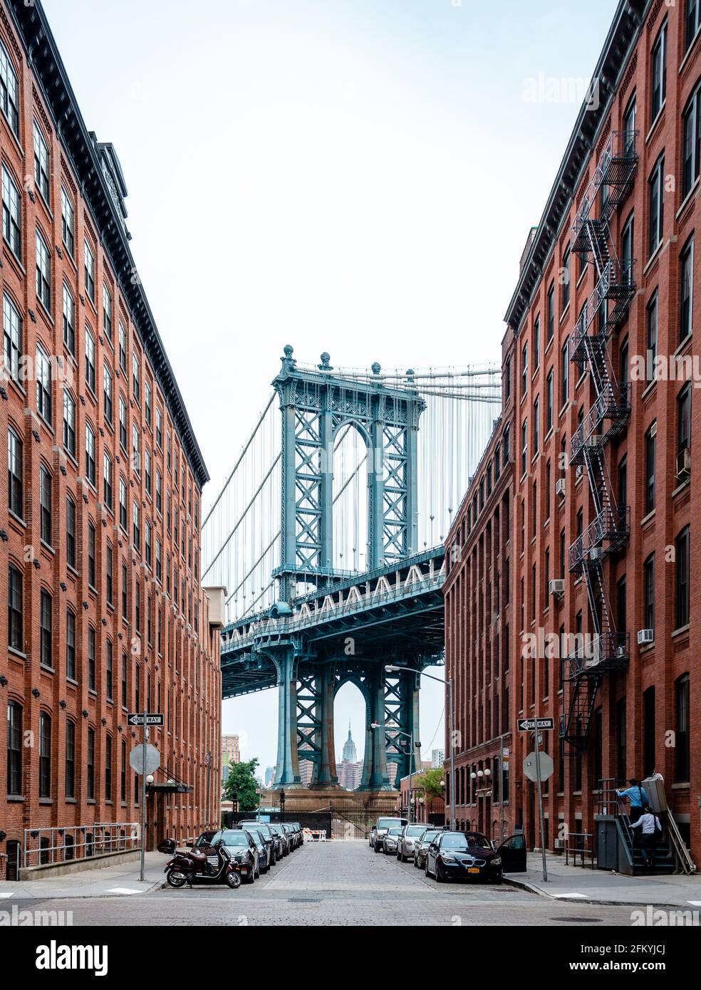 New York City, NY, USA - July 16 2014: The Manhattan bridge from Brooklyn Heights (Washington St and Water St), with the Empire State Building in the Stock Photo
