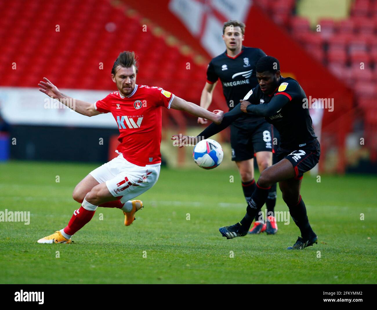 Woolwich, UK. 04th May, 2021. WOOLWICH, United Kingdom, MAY 04: L-R Charlton Athletic's Alex Gilbey and TJ Eyoma of Lincoln City (on loan from Tottenham Hotspur) during Sky Bet League One between Charlton Athletic and Lincoln City at The Valley, Woolwich on 04th May 2021 Credit: Action Foto Sport/Alamy Live News Stock Photo