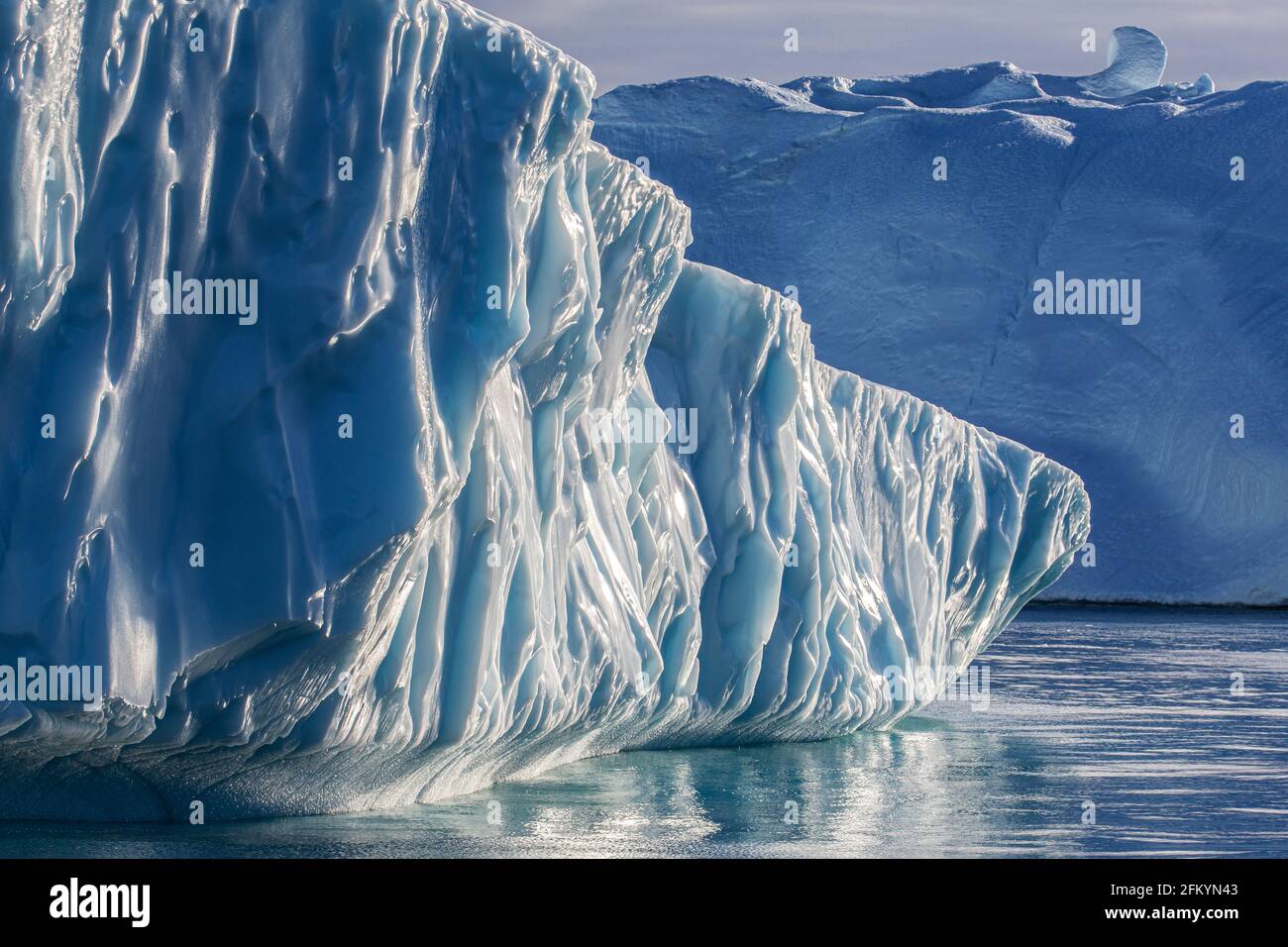 Massive icebergs calved from the Jakobshavn Isbræ glacier, UNESCO World Heritage site, Ilulissat, Greenland. Stock Photo