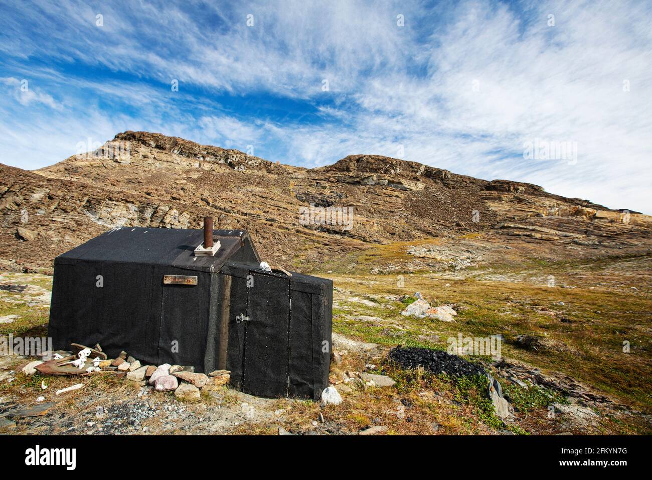 Exterior view of a hunters cabin in Blomster Bugten, Flower Bay, Greenland. Stock Photo