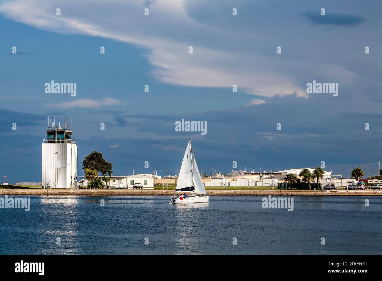 Control tower at Albert Whittled Airport with sailboat in foreground on Tampa Bay. Saint Petersburg, Florida Stock Photo