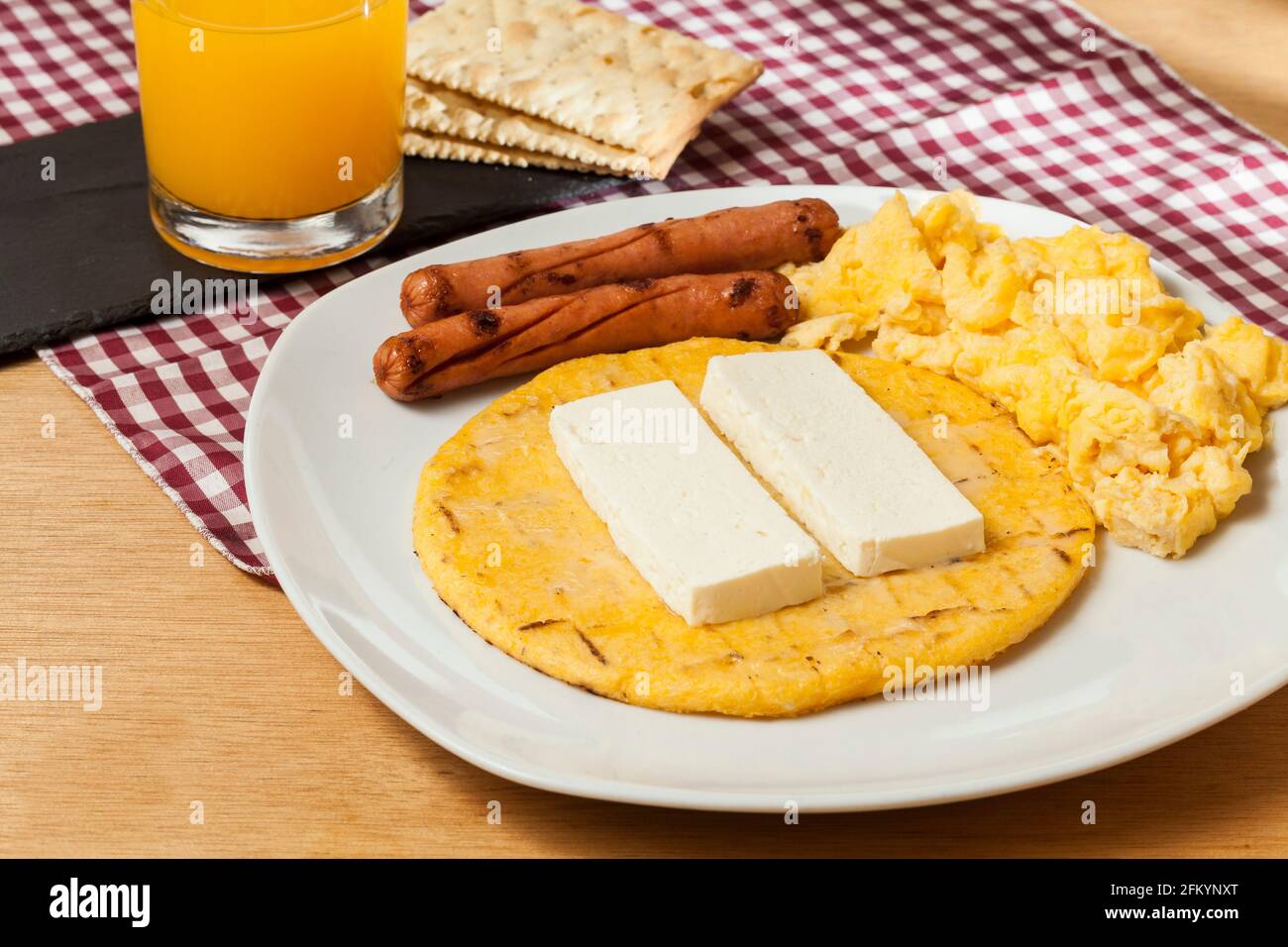 Tasty traditional breakfast in Colombia; Arepa of yellow corn with