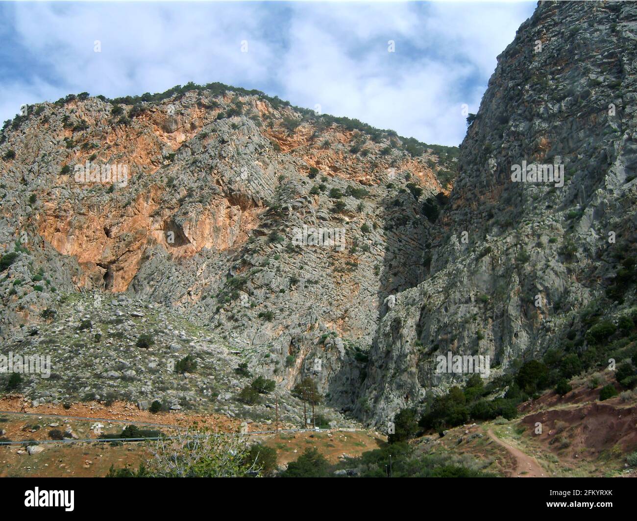 Beautiful view of rocky mountains under a cloudy sky Stock Photo - Alamy