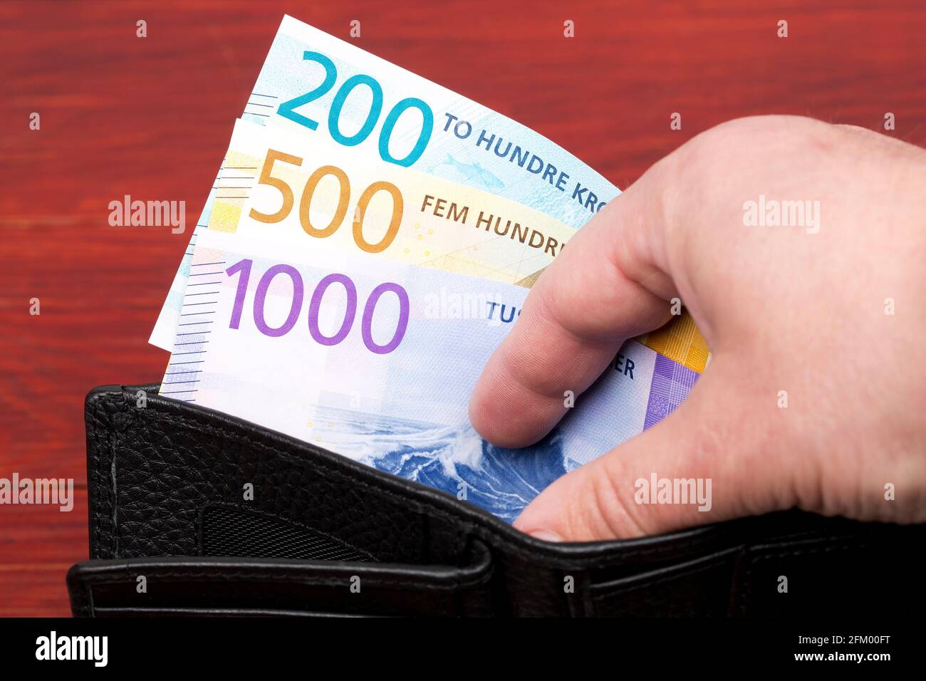 Norwegian krone in the black wallet Stock Photo