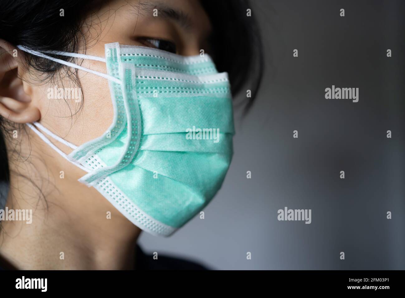 Wearing two face masks hi-res stock photography and images - Alamy