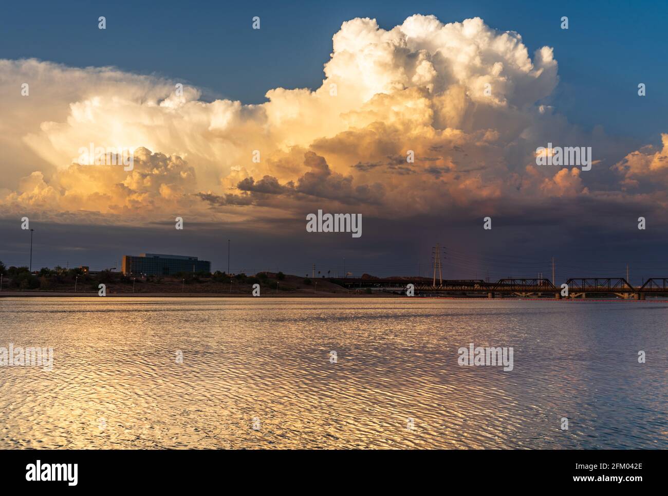 Beautiful sunset thunderstorm reflecting on a lake Stock Photo