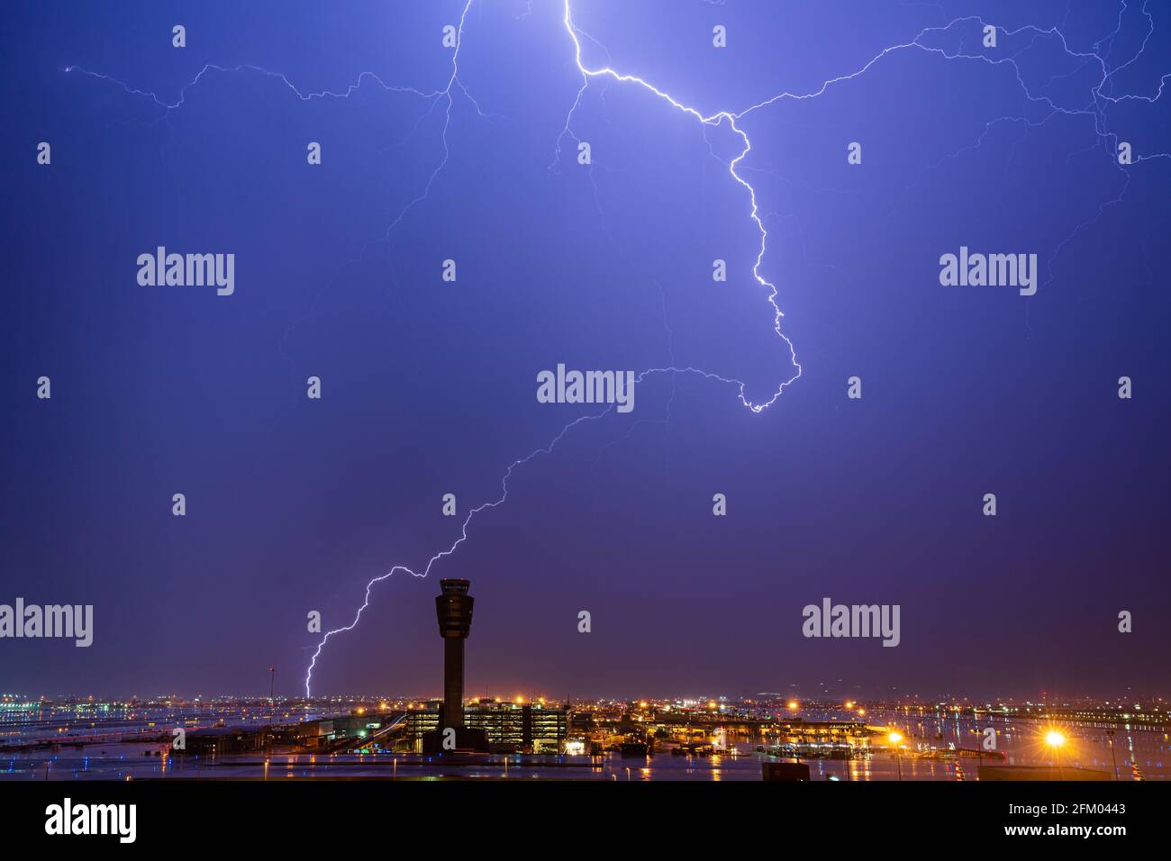 Close Lightning Strike in Front of Approaching Dust Storm Stock Photo