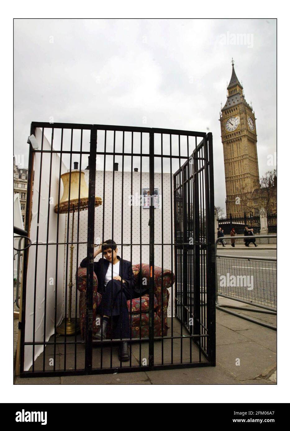 Amnesty International & Liberty demonstrate outside Parliament against the Prevention of Terrorism Bill.Shami Chakrabarti director of Liberty in the home cell as part of the demo. pic David Sandison 9/3/2004 Stock Photo