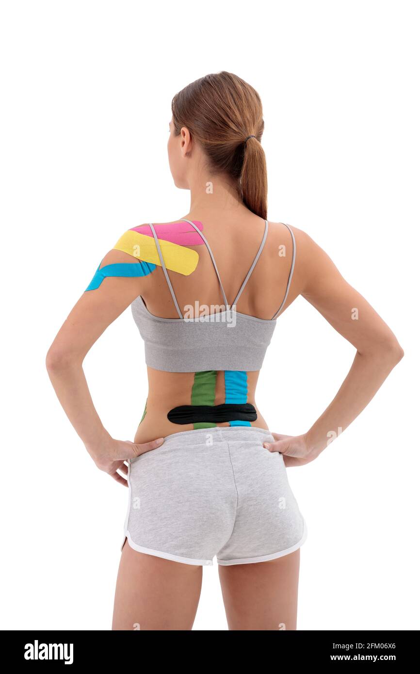 Therapy with kinesio tex tape. Woman with kinesiology tape on back and  shoulder. Isolated on white background Stock Photo - Alamy