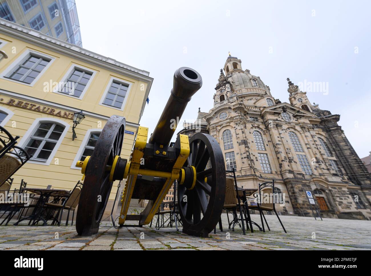 Dresden, Germany. 05th May, 2021. The Neumarkt is empty of people around a historic cannon in front of a restaurant near the Frauenkirche. Credit: Robert Michael/dpa-Zentralbild/dpa/Alamy Live News Stock Photo
