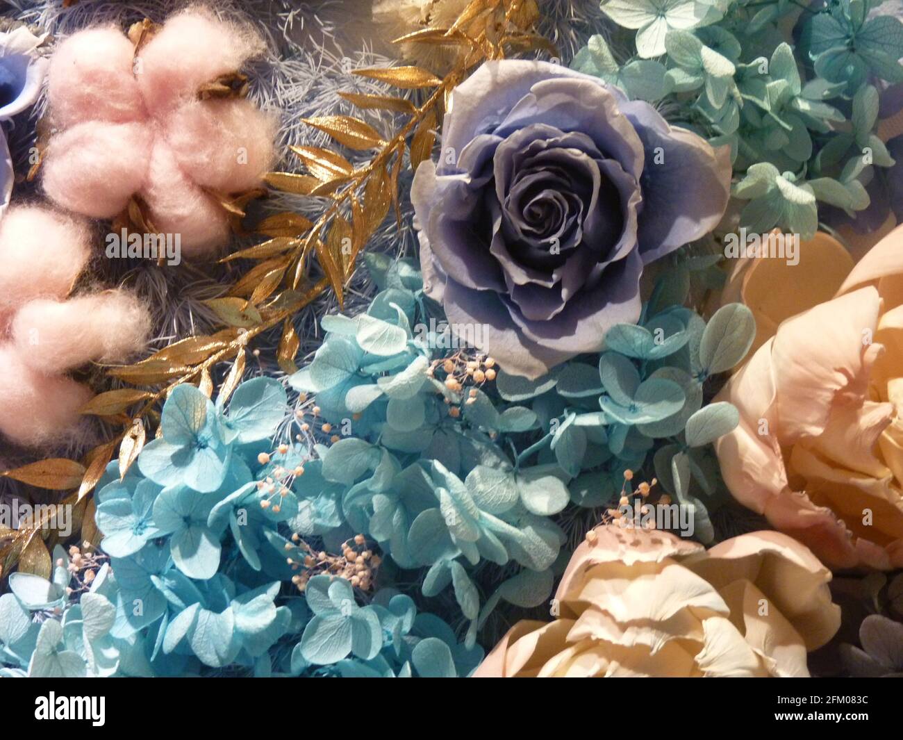 Overhead shot of an artificial floral design of different colors Stock