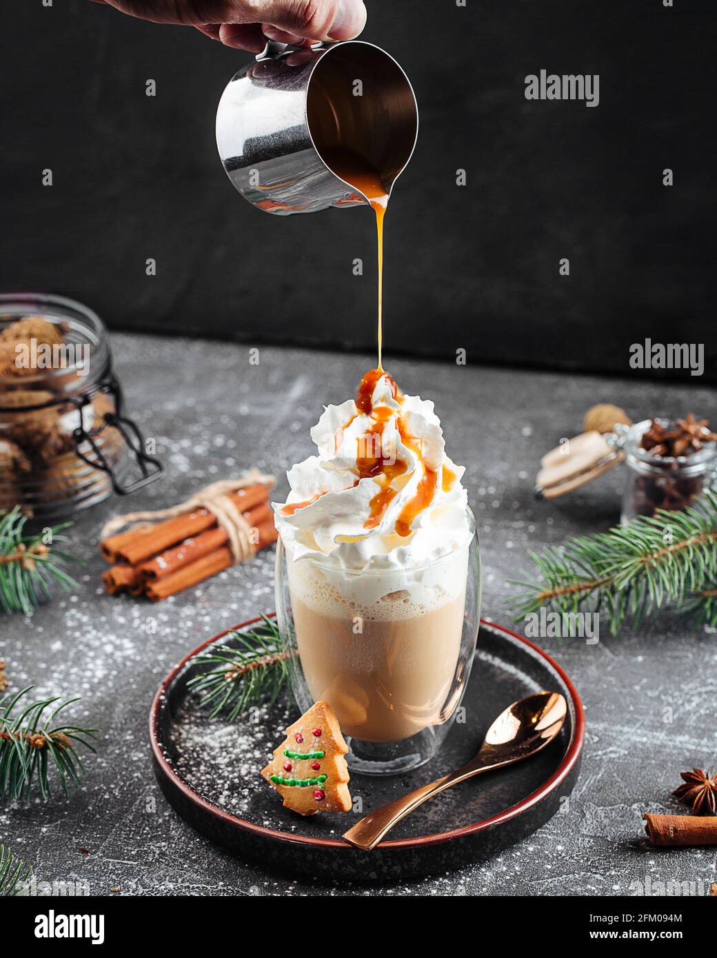 Pouring sweet coffee latte with caramel syrup Stock Photo