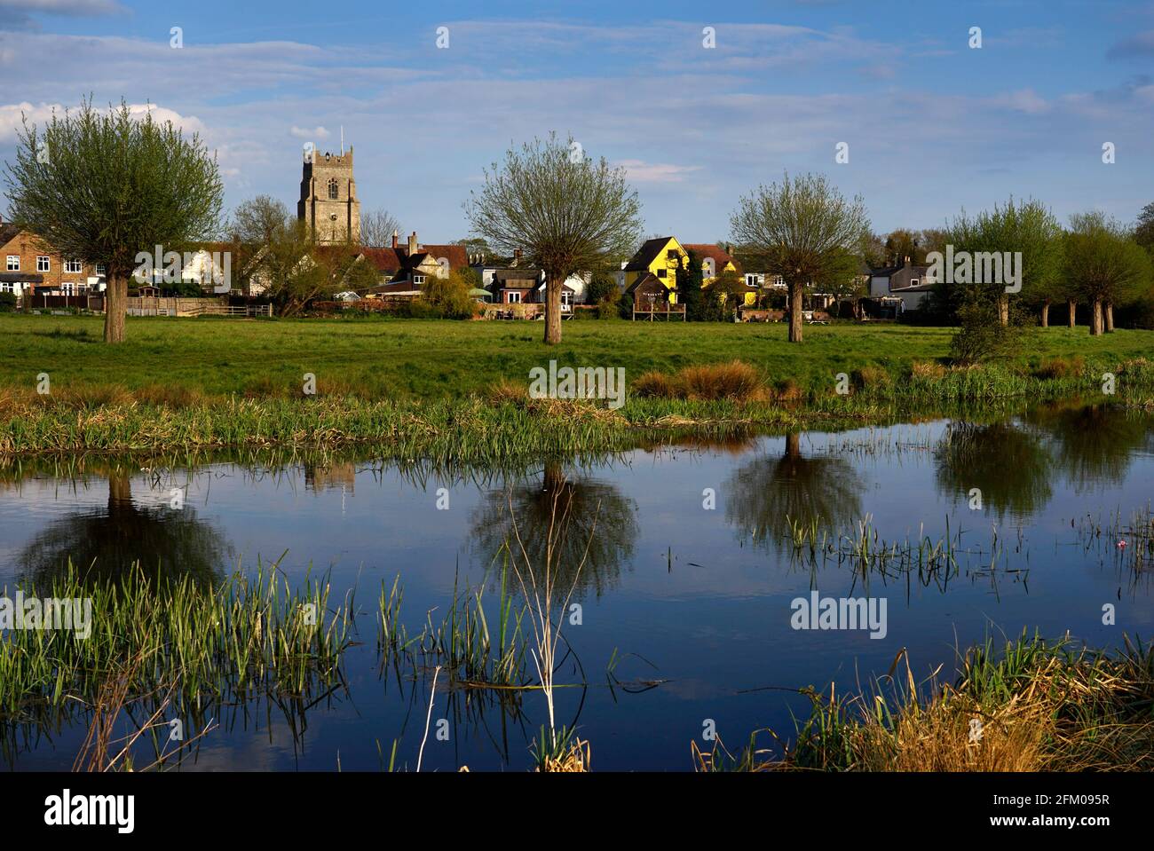 Views across river Stour on water meadows to all saints church and market town of Sudbury,Suffolk,England,Birth place of Thomas Gainsborough Stock Photo