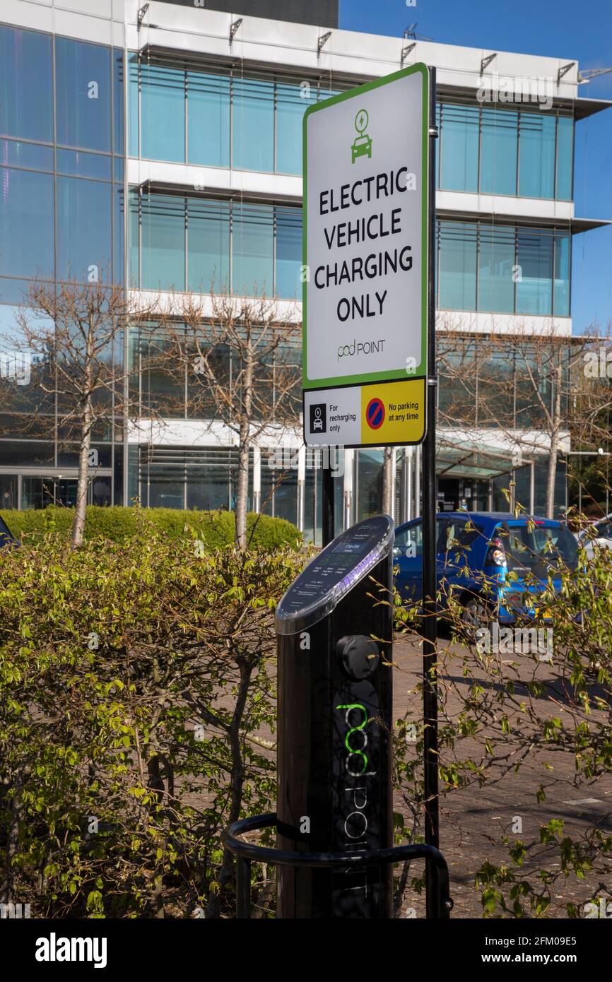 Car electric charging point on office estate,Oxford,England Stock Photo