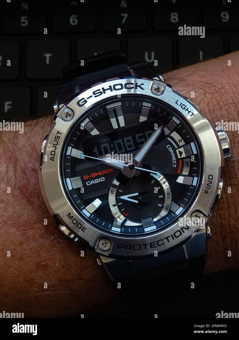 Casio GST-B200 solar atomic bluetooth multi-band 6 wrist watch on a  silicone band on black keyboard background Stock Photo - Alamy