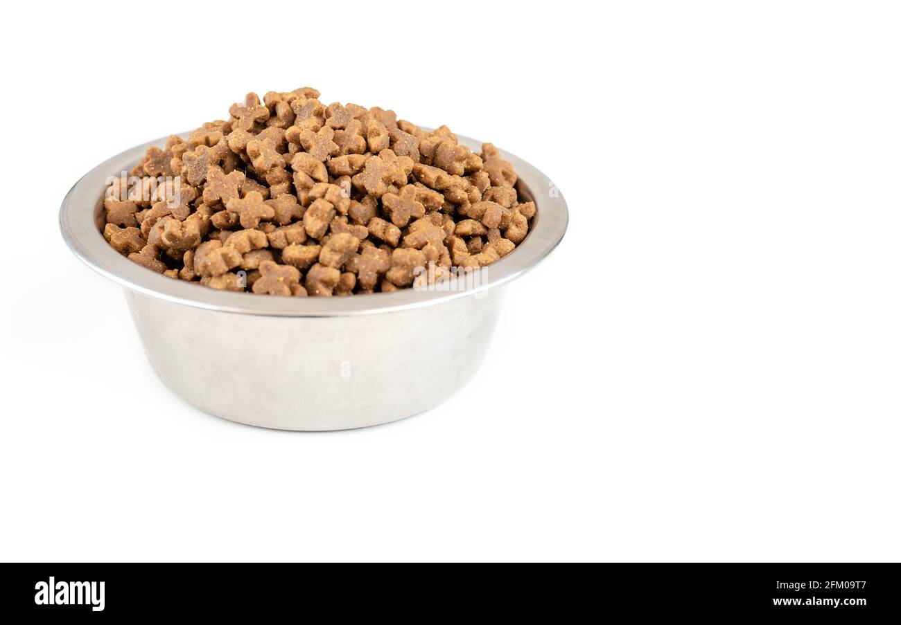 Bowl full of dry pet food isolated on white background, side viev Stock  Photo - Alamy