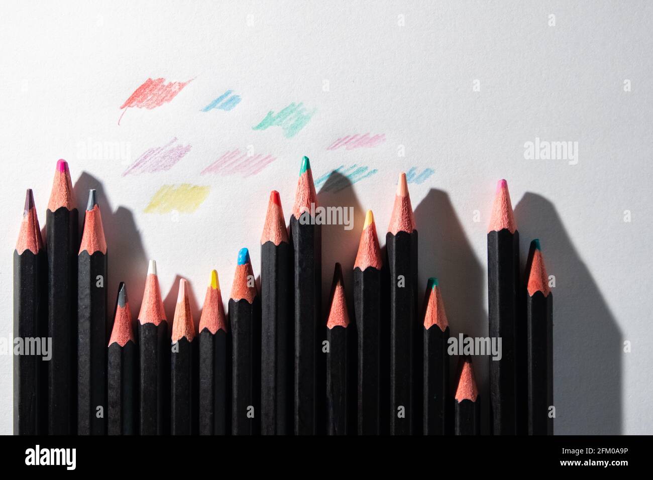 Lyon (France), May 02, 2021. Coloured pencils lined up on a white sheet. Stock Photo