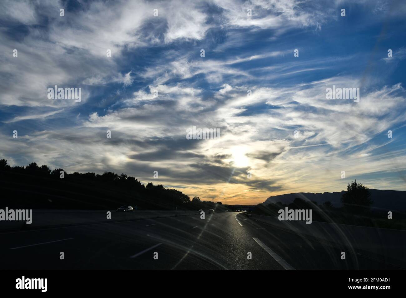 Sun setting on the highway in Montpellier, Occitanie, south of France Stock Photo