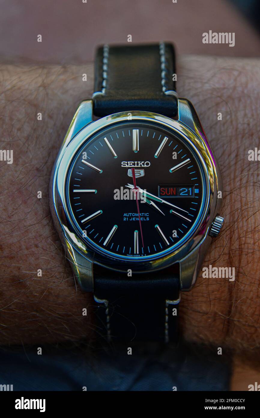 Seiko 5 sports wrist watch on a black leather strap Stock Photo - Alamy
